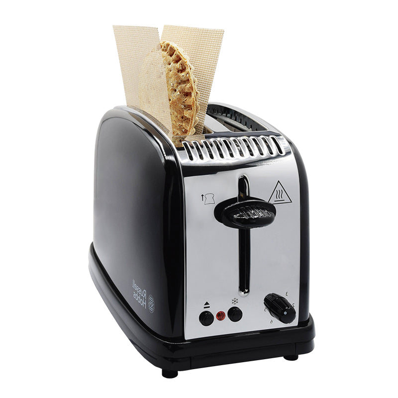 An image of the CRIMPiT snack in the CRIMPiT Cradle which has been inserted into the toaster. 